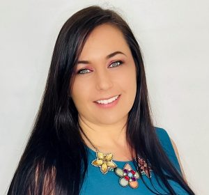 Tiffany Kaehler, The Florist Coach – florist business coach and third-generation florist, smiling professional portrait