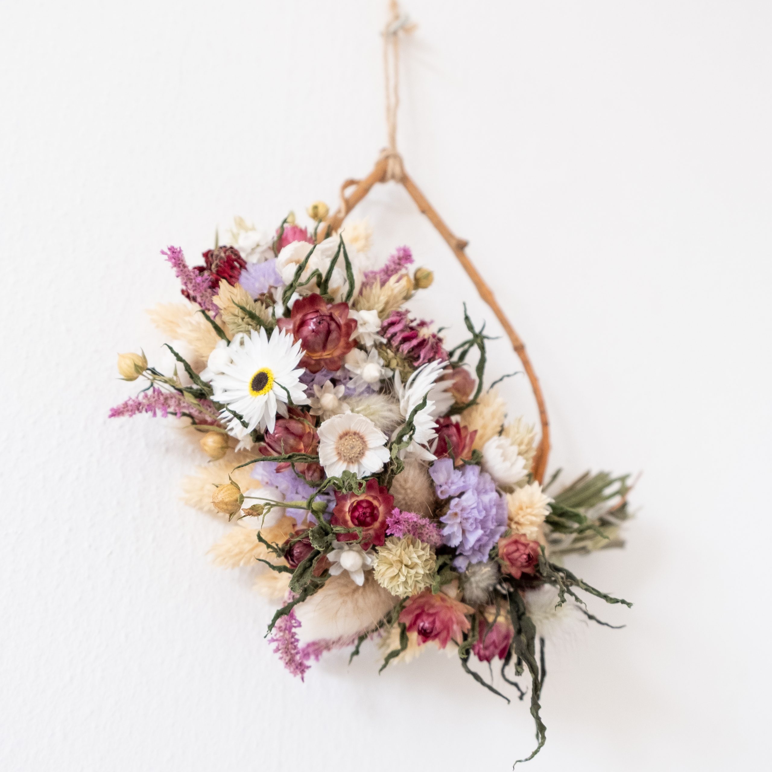 close up of dried flowers on a mini gift sized wreath