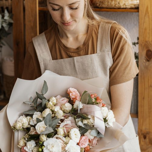 young-woman-making-pretty-floral-arrangement